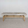 front view of a mottled grey cowhide bench or ottoman