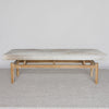 front view of a cream and grey cowhide ottoman bench seat from corcovado