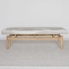 front view of a cream and grey cowhide ottoman bench seat from corcovado