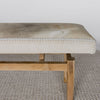 close up view of a cowhide bench seat in cream and grey tones from corcovado