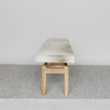 end view of a a creamy grey coloured cowhide bench seat from corcovado