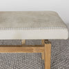 close up corner shot of a a creamy grey coloured cowhide bench seat from corcovado