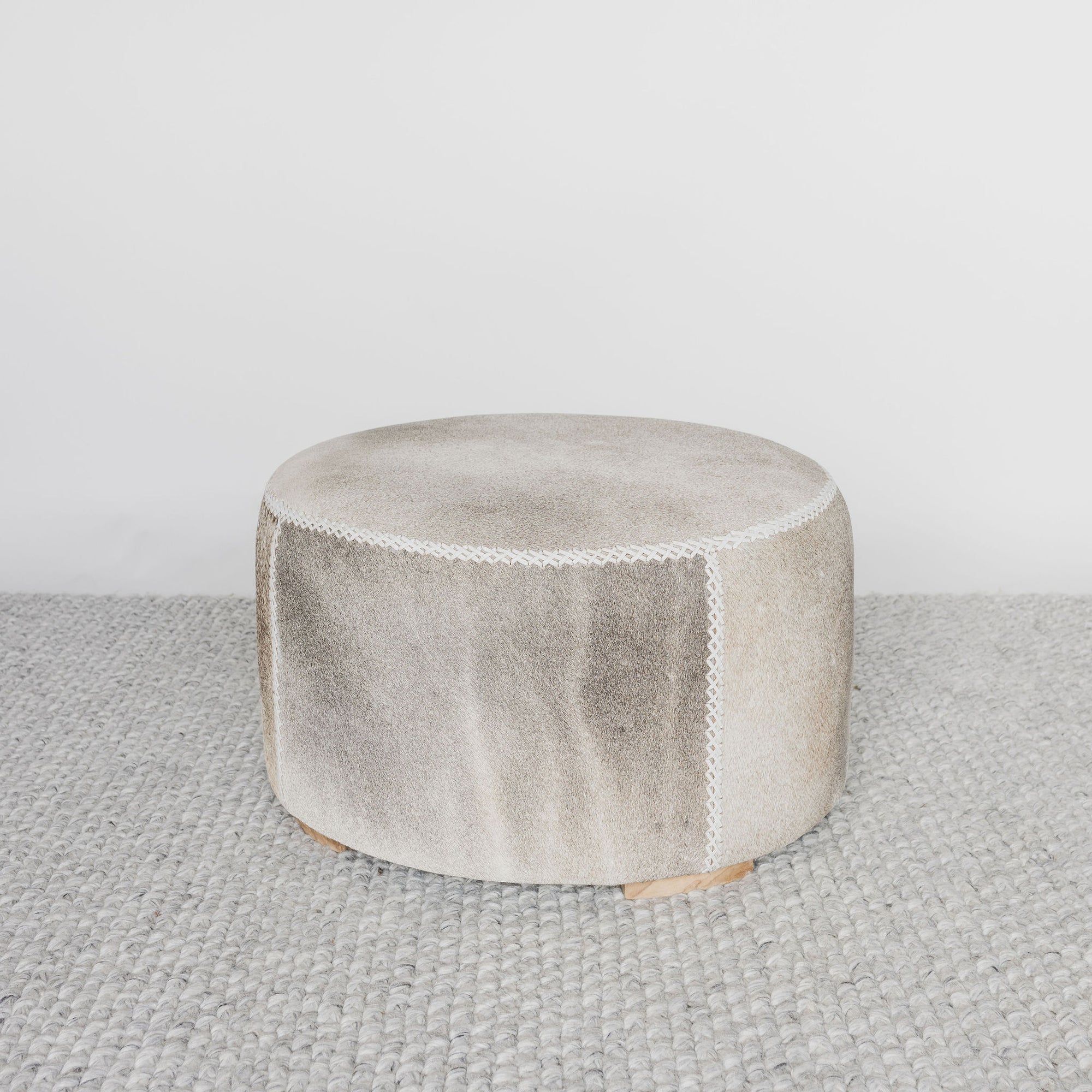 grey and cream round cowhide ottoman coffee table 