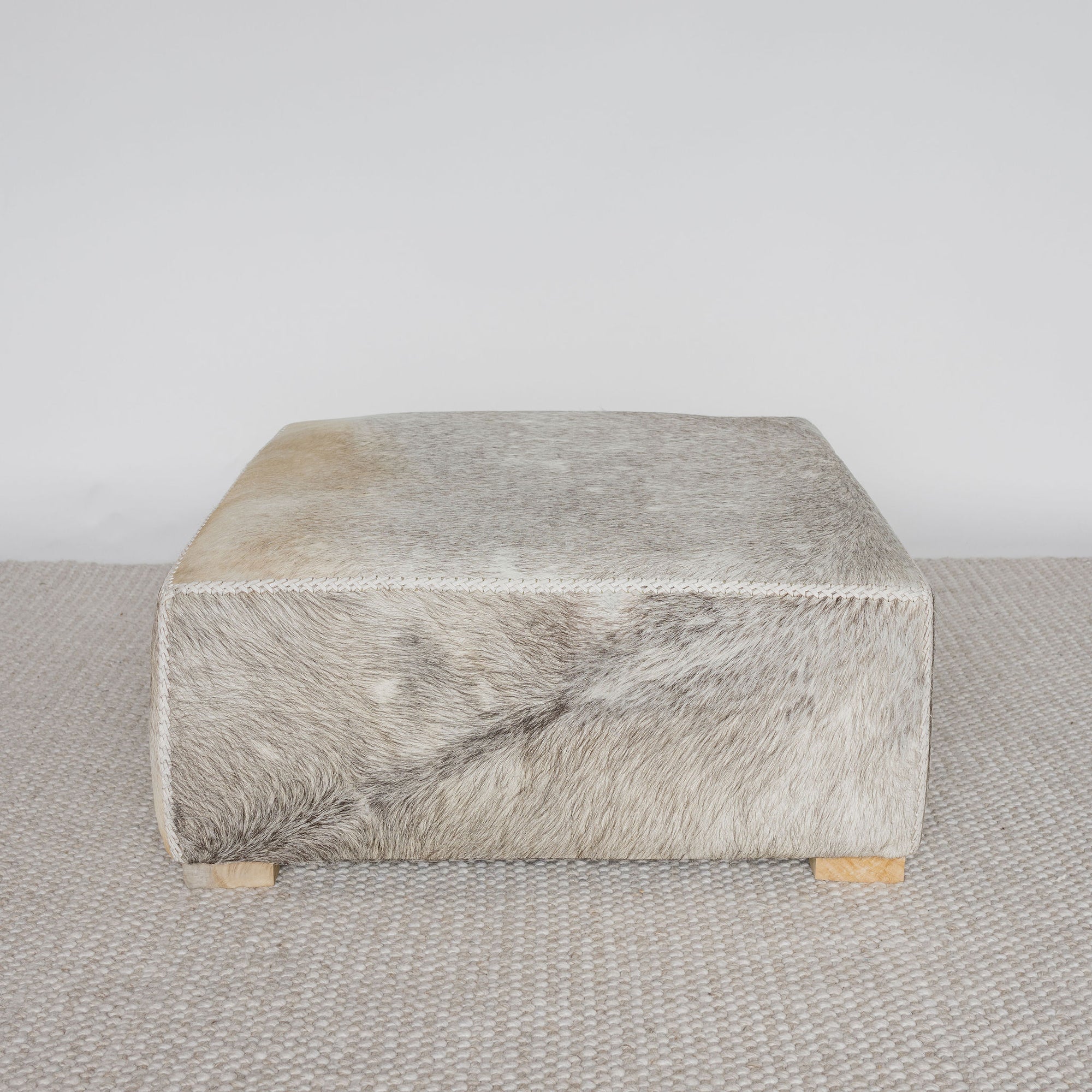 extra large grey coloured square cowhide ottoman coffee table