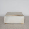 another view of the square cowhide ottoman coffee table in natural earthy tones