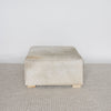 square cowhide ottoman coffee table in natural tones