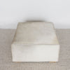 top down view of the square cowhide ottoman coffee table in natural tones