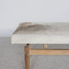 close up view showing the cowhide detail on the grey and cream coloured cowhide bench seat ottoman from Corcovado