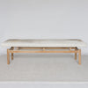 long front view of the grey and cream coloured cowhide bench seat ottoman from Corcovado