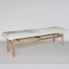 angled view of the grey and cream coloured cowhide bench seat ottoman from Corcovado