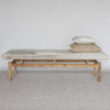 long cowhide bench seat with grey and cream coloured cowhide