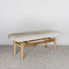 angled view of a light coloured cream cowhide bench seat from corcovado