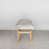 end view of a light coloured cream cowhide bench seat from corcovado