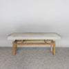 front view of an earthy cream colored cowhide bench seat from corcovado