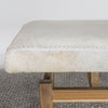 close up of an earthy cream colored cowhide bench seat from corcovado