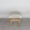 end view of the cowhide bench seat in light cream tones by corcovado