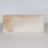 top down view of the caramel coloured and cream cowhide bench seat