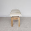 end view of the cream coloured cowhide ottoman bench seat