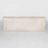 top down view of a cream coloured cowhide bench seat ottoman