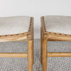 close up showing the detail of the small cowhide bench seats