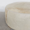 close up view of a round cowhide ottoman coffee table by corcovado