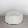 cream coloured light cowhide round ottoman coffee table