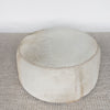 top view of the cream coloured round cowhide ottoman coffee table from corcovado