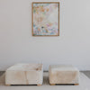 abstract art work with cow hide square ottomans from corcovado