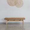 80cm diameter rattan wall sculpture above an upholstered bench by Corcovado