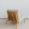 back view showing the slated back of an oversized teak wood armless chair by Corcovado