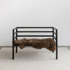 black teak wood entry bench from Corcovado with a natural sheepskin rug