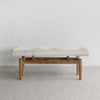 full front view of the soft creamy white cowhide bench ottoman seat from corcovado