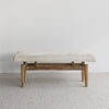 front view of the soft creamy white cowhide bench ottoman seat from corcovado