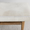 close up of the soft creamy white cowhide bench ottoman seat from corcovado