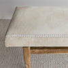 close up photo showing the leather stitching detail on the soft creamy white cowhide bench ottoman seat from corcovado