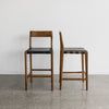 savanna bar stool with vintage brown wood and black leather seat from Corcovado