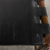 close up view of the leather on the savanna bar stool with vintage brown wood and black leather seat from Corcovado