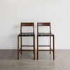 serengeti bar stools with black woven leather seat and dark brown wood