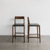 serengeti bar stool with black woven leather seat and dark brown wood