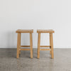 set of two light teak wooden chinese style bar stools from corcovado