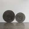 blackwash rattan wall art in 100cm dia next to the smaller size of 80cm diameter.