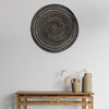 blackwash rattan wall art above a natural wood hallway console table