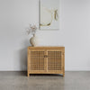 teak wood buffet cabinet for living room spaces with cream terracotta vase and oil painting