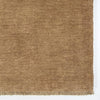 corner shot of the fringed fenugreek wool floor rug